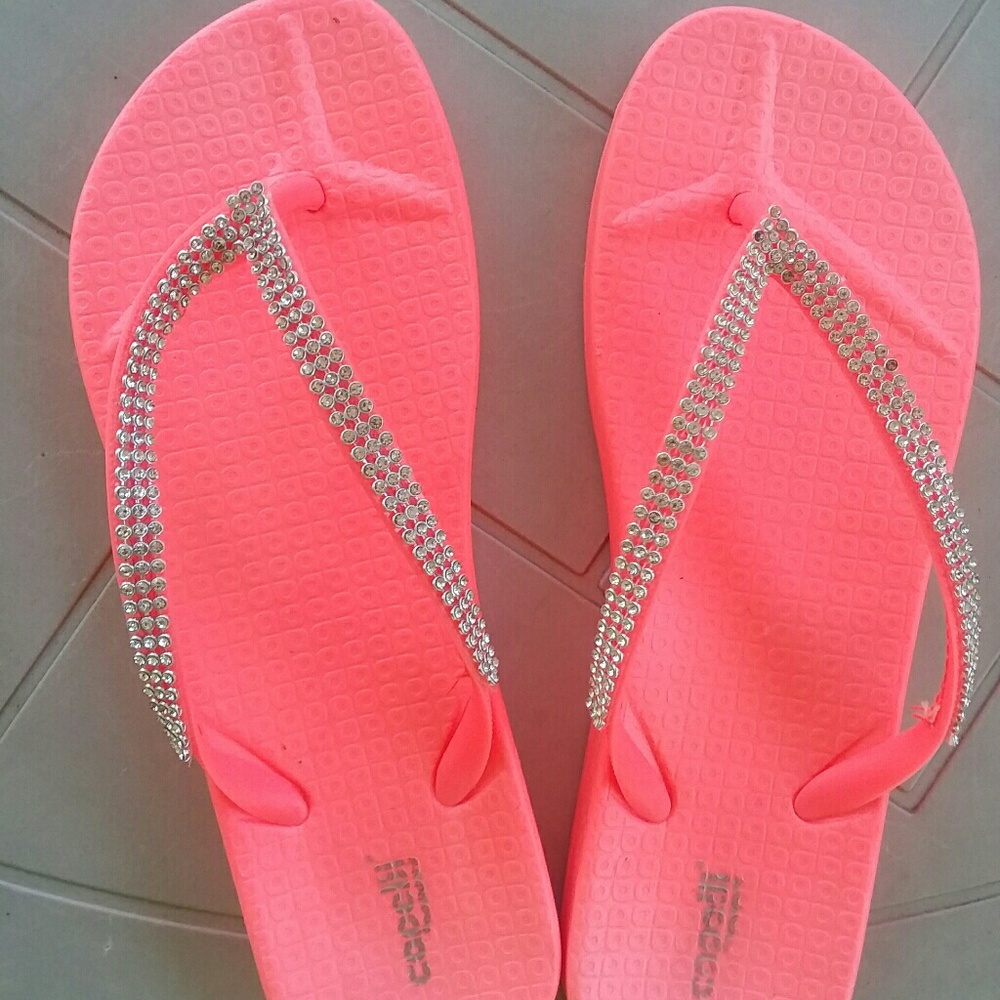 Neon orange flip flops